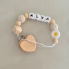 Attache tétine tons nude